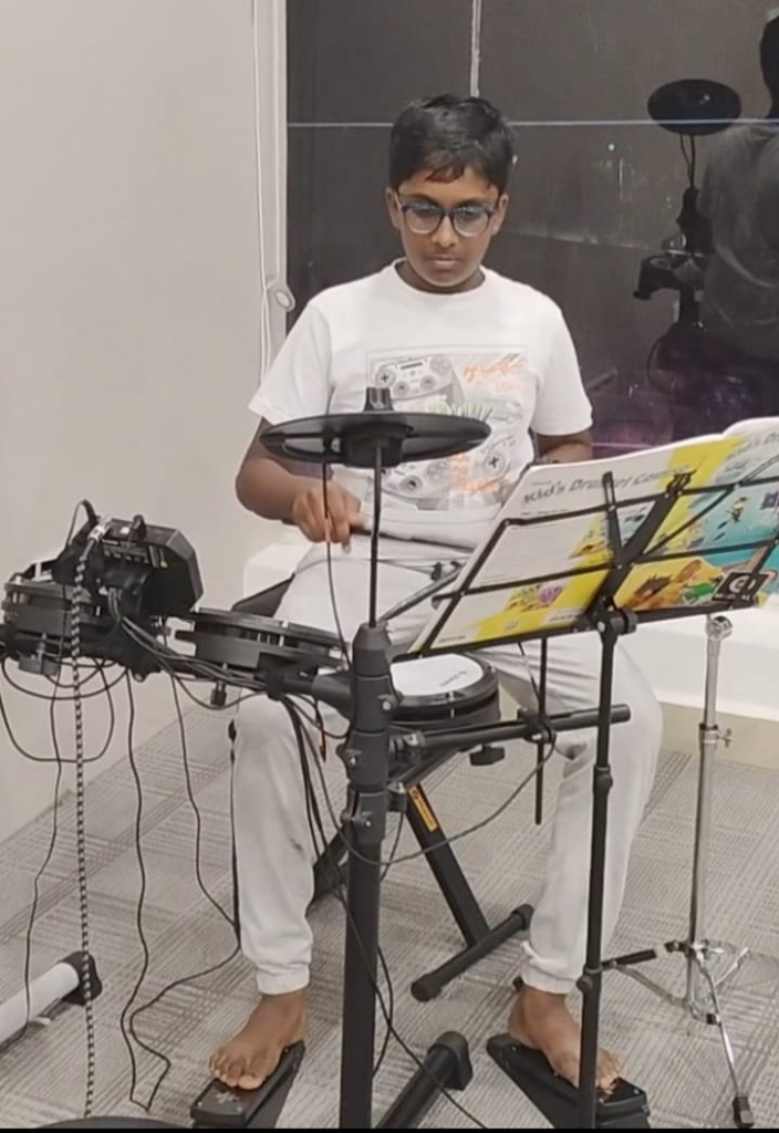 Student playing drums at Nizampet Music Academy, Hyderabad